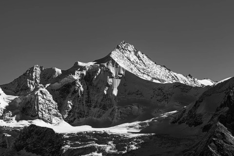 Snowy peak of Zinalrothorn mountain, black and white photo, Val d'Anniviers, Valais Alps, Canton of