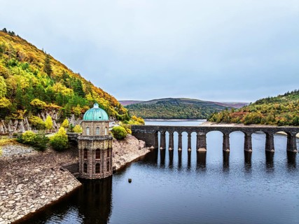 Autumn over Garreg Ddu Dam from a drone, Elan Valley, Caban-Coch Reservoir, Rhayader, Wales, UK