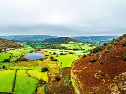 Autumn Colours over Gwynllyn Lake and Stream Nantgwynllyn from a drone, Rhayader, Powys,