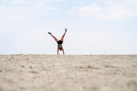 Abstract, woman doing gymnastics in a whirring landscape, Etosha pan, Etosha National Park, Namibia