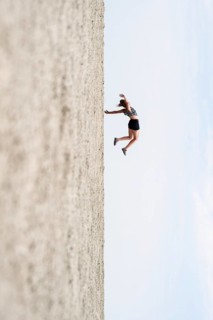 Symbolic picture, abstract, woman falling, rotated image on the Etosha pan, salt pan, Etosha