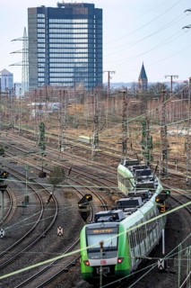 S-Bahn train on the route east, in front of Essen main station, town hall, regional transport North