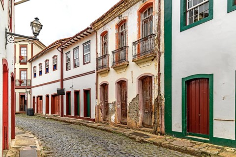 Strolling down the street among the colonial houses of the historic city of Ouro Preto, Ouro Preto,
