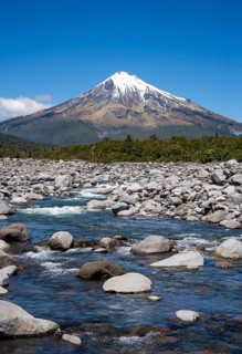 Mount Taranaki, in the foreground Stony River (Hangatahua River) . Egmont National Park, Taranaki