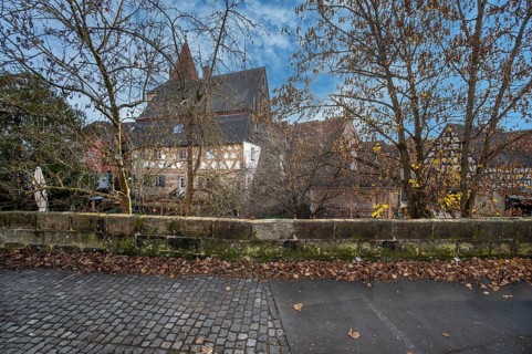 Historic city wall with old town houses, half-timbered house from 1799 in the back, Lauf an der