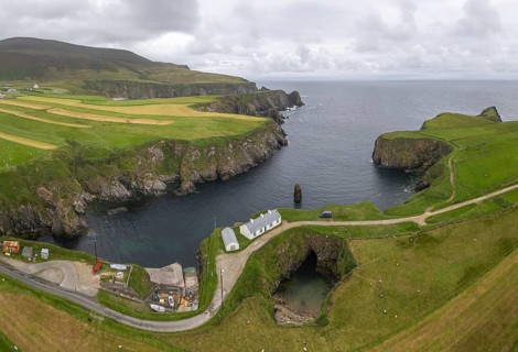 Aerial view of bay with small harbour and rock gate, Malin Beg, Malinbeg, County Donegal, Ireland