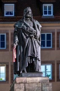 Illuminated statue of Albrecht Dürer in the evening, Albrecht-Dürer-Platz, Nuremberg, Middle