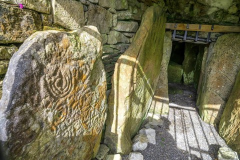 Entrance with decorated wall stone of Loughcrew Cairns a megalithic grave, Stonefield, County