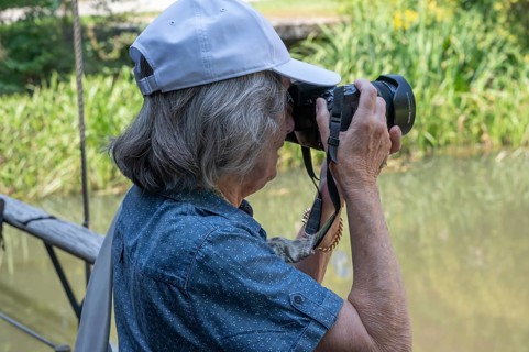 Elderly woman taking pictures, Amberg Upper Palatinate, Bavaria, Germany