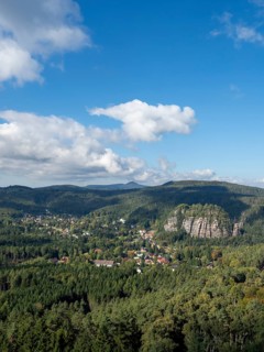 Mountain landscape with forest, rocks and village, view of Oybin, Zittau Mountains, Saxony, Germany