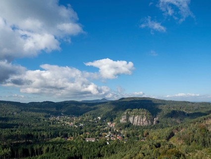 Mountain landscape with forest, rocks and village, view of Oybin, Zittau Mountains, Saxony, Germany