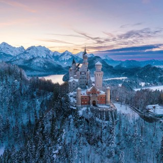 Neuschwanstein Castle in winter surroundings at sunset, Schwangau near Füssen, Ostallgäu, Allgäu,