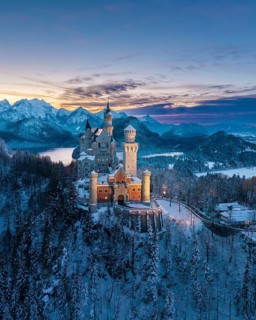Snowy landscape around Neuschwanstein Castle in evening light, Schwangau near Füssen, Ostallgäu,