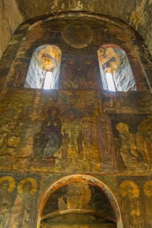 Old wall paintings in a church depicting saints and religious symbols, Akhtala monastery, Akhtala