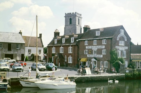 The Old Granary restaurant on the quayside and Priory Church of Lady St Mary, River Frome, The