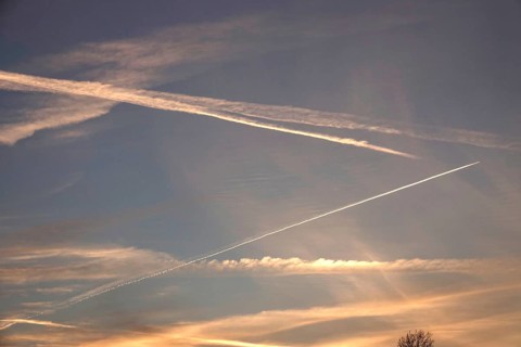 Picturesque evening sky with contrails, autumn, Germany