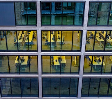 Desks with computers, workstations in an office complex on the former Tacheless, Berlin, Germany