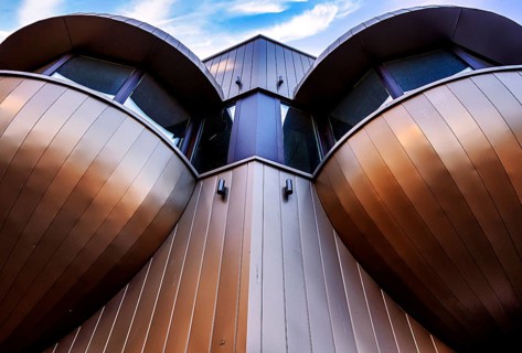 Futuristic balconies with bay windows on a prefabricated building from the sixties in