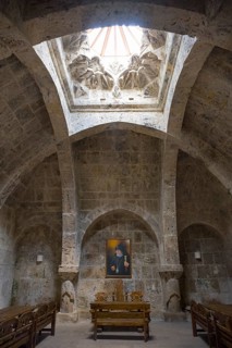 Church interior with skylight and painting, stone walls and vault, refectory interior, dining room,