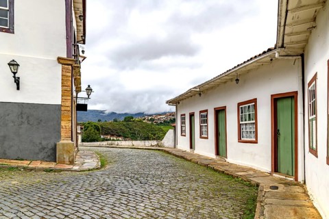 A winding street between historic houses in the city of Ouro Preto, Ouro Preto, Minas Gerais,