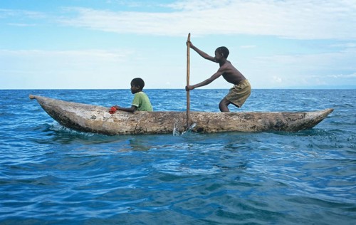 Two boys in a dugout on Lake Malawi, Malawi, Africa, July 2000, vintage, retro, old, historic