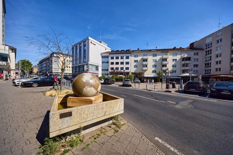 Stone fountain, sidewalk, concrete paving stones, general architecture, houses, residential and