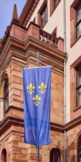 Flag of the city of Wiesbaden, town hall, façade, sandstone building material, architect Georg von
