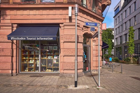 Wiesbaden tourist information, historic commercial building, awnings, shop windows, tourist