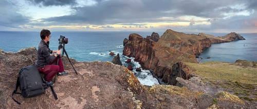Photographer taking pictures on cliffs, volcanic peninsula, Ponta de São Lourenço, Ponta de Sao