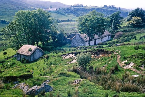 Thatched stone blackhouse traditional croft farmhouse building, Portnoo, County Donegal, Ireland