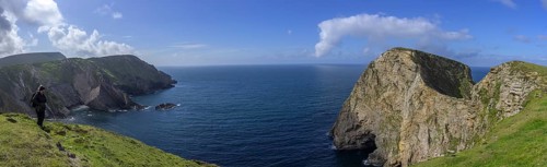 View of blue sea and cliffs with rock gate from Portacloy Loop Cliff Walk, Muingnabo, County Mayo,