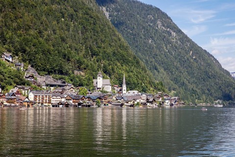 A, Hallstatt, An idyllic lakeside village with a church, surrounded by wooded mountains, Austria
