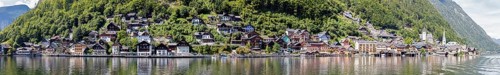 A, Hallstatt, Pano, k, panoramic view of a village on the shore of a lake, nestled in green hills,