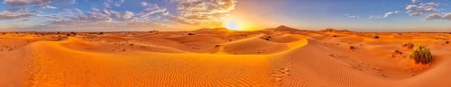 Sunset over a vast desert landscape with sand dunes, Sahara, Morocco