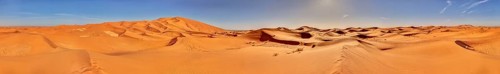 Wide desert landscape with sand dunes and clear sky, Sahara, Morocco
