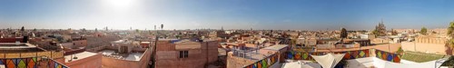 Panoramic view of a Moroccan city with traditional roofs and clear skies