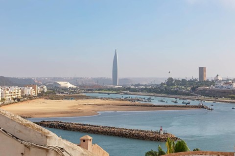 Estuary with beaches and a distinctive skyscraper in the background, Mohammed VI Tower in Rabat in