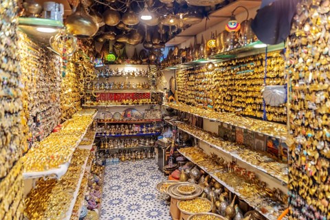 Tight shop full of shiny golden decorations and jewelry