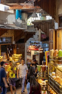 A wide range of spices in a lively bazaar with traditional stalls