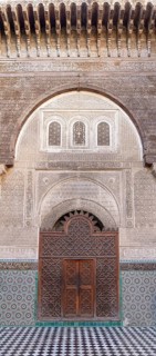 Impressive gate with rich decorations and mosaics in traditional architecture