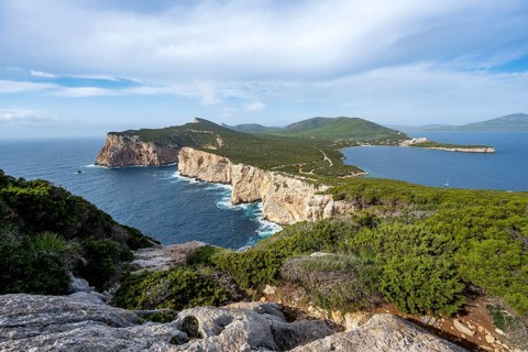 Steep cliffs by the sea, coastal landscape, cliffs on the Capo Caccia headland, Alghero, Sardinia,