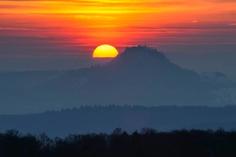 The distinctive silhouette of the Hohentwiel Hegau volcano at sunset, Konstanz district,