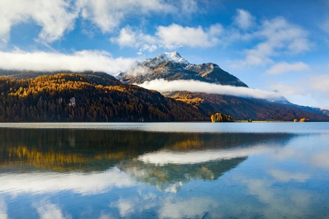 Clouds of fog over Lake Sils with Piz da la Margna in the background, Upper Engadin, Canton of