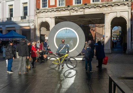 People on the Cornhill in the town centre view the first ever UK Portal in Ipswich, Suffolk,