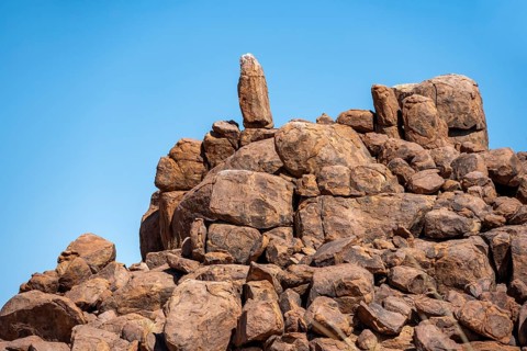 Round spherical rocks stacked into hills, Brandberg, Damaraland, Erongo, Namibia