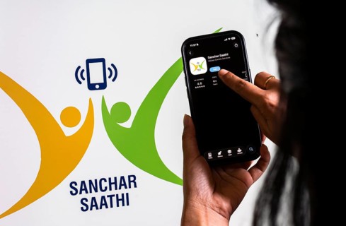 In this photo illustration, a person downloads the Sanchar Saathi mobile application on an iPhone,