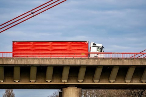 Truck, truck with trailer, on the A42 bridge across the Rhine near Duisburg-Beeckerwerth