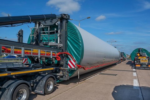 Heavy-duty transporter with a part of a wind turbine, at a motorway rest area of the A9,