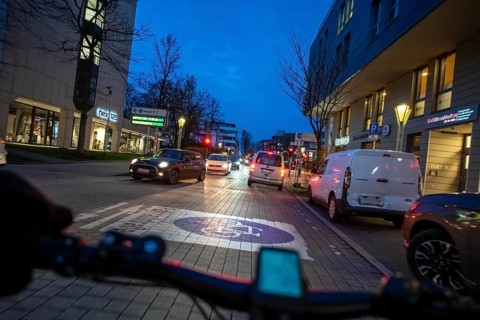 Cycling in the city, in the dark, in the evening, inner-city road, bicycle road, two-wheeler