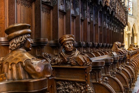 The choir stalls in Ulm Minster by Jörg Syrlin the Younger with impressive carvings. interior view.